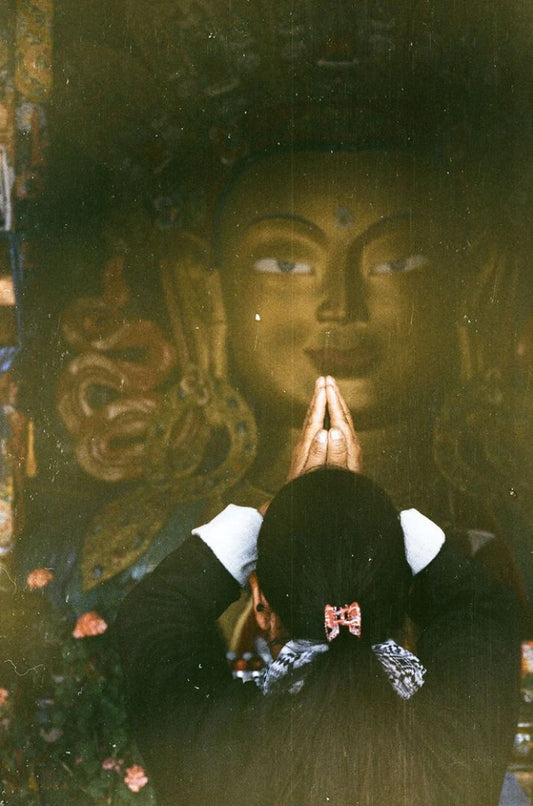 'A woman praying at Thiksey monastery' - Aman Chotani original print
